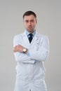 Portrait of mature serious male doctor with crossed arms Royalty Free Stock Photo