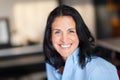 Portrait Of A Mature Spanish woman Smiling At The Camera. At The home