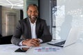 Portrait of mature successful adult African American businessman, boss smiling and looking at camera working inside Royalty Free Stock Photo