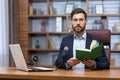 Portrait mature successful businessman teacher, man recording audio podcast reading book, boss in glasses looking Royalty Free Stock Photo