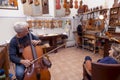 Portrait of mature violin maker Royalty Free Stock Photo