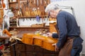 Portrait of mature violin maker Royalty Free Stock Photo