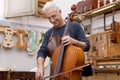 Portrait of mature violin maker Royalty Free Stock Photo