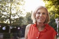 Portrait Of Mature Woman In Back Yard Garden Royalty Free Stock Photo