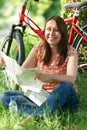 Portrait Of Mature Woman On Cycle Ride In Countryside Reading Ma Royalty Free Stock Photo