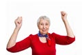 Portrait of a mature woman doing a winner gesture Royalty Free Stock Photo