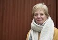 Portrait of a mature woman outdoors in winter with a large scarf Royalty Free Stock Photo