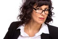 Portrait of mature woman smiling, wearing glasses, looking at ca Royalty Free Stock Photo