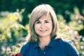 Portrait of mature woman standing in garden Royalty Free Stock Photo