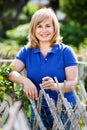 Portrait of mature woman standing in garden Royalty Free Stock Photo