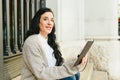 Portrait mature woman taking notes in her notebook, reading plans, side view Royalty Free Stock Photo