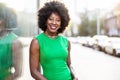 Woman wearing green dress standing in the city Royalty Free Stock Photo