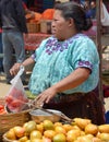 Portrait of a Mayan woman saling fruits and vegetables. Royalty Free Stock Photo