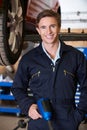Portrait Of Mechanic In Garage With Air Hammer Royalty Free Stock Photo