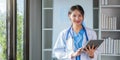 Portrait medical concept of Asian beautiful female doctor in white coat with stethoscope, waist up. medical