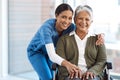 Portrait, medical or disability with a nurse and old woman in a wheelchair during a nursing home visit. Smile