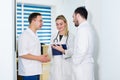 Portrait of medical team standing in hospital hall Royalty Free Stock Photo
