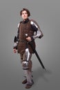 Portrait of a medieval female knight in armour over grey background Royalty Free Stock Photo