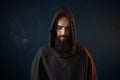 Portrait of medieval monk in black robe with hood Royalty Free Stock Photo