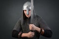 Portrait of a medieval warrior of the late Viking era and the beginning of the Crusades. Knight in chain mail and helmet