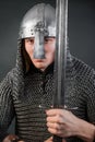 Portrait of a medieval warrior of the late Viking era and the beginning of the Crusades. Knight in chain mail and helmet