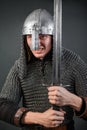 Portrait of a medieval warrior of the late Viking era and the beginning of the Crusades. Knight in chain mail and helmet