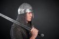 Portrait of a medieval warrior of the late Viking era and the beginning of the Crusades. Knight in chain mail and helmet