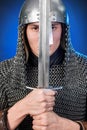 Portrait of a medieval warrior of the late Viking era and the beginning of the Crusades. Knight in chain mail and helmet