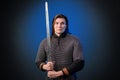 Portrait of a medieval warrior of the late Viking era and the beginning of the Crusades. Knight with long hair in chain mail Royalty Free Stock Photo