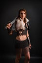 Portrait of a medieval woman warrior in chain mail armor and polar fox fur on her shoulders standing with a sword in hand Royalty Free Stock Photo