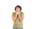 Portrait of melancholic young man, long curly hair style, keeps fists under chin, looking confused and dissatisfied. Person