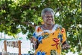 Portrait of a melanesian - australian artisan mature woman smiling, outdoors. Royalty Free Stock Photo