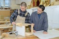 portrait man and apprentice in carpentry class Royalty Free Stock Photo