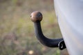 A portrait of a metal car tow bar for pulling a small trailer or caravan. The anchor can also be used to pull something else by