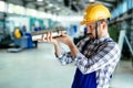 Portrait of an metal engineer working at factory