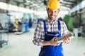 Portrait of an metal engineer working at factory