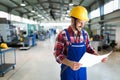 Portrait of an metal engineer working at factory