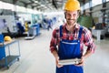 Portrait of an metal engineer working at factory