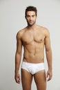 Portrait of mid adult man in briefs Royalty Free Stock Photo