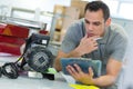 portrait mid-adult man fixing lights Royalty Free Stock Photo