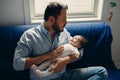 father trying to calm down pacify newborn baby