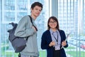 Portrait of middle aged female teacher and male college student Royalty Free Stock Photo