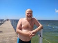 Portrait of a middle aged man standing at the pier