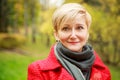 Portrait of Middle Aged Woman on Autumn Background Royalty Free Stock Photo