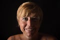 Portrait of a middle aged woman on blac Royalty Free Stock Photo