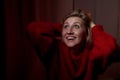 Portrait of a middle-aged woman in the room. Photography in the Studio. Photo shoot in a dark key