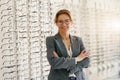 Portrait of middle-aged woman wearing glasses in optical store Royalty Free Stock Photo