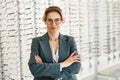 Portrait of middle-aged woman wearing glasses in optical store Royalty Free Stock Photo