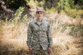 Portrait of military soldier standing in grass Royalty Free Stock Photo