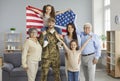 Portrait of happy American soldier in camouflage uniform together with his family Royalty Free Stock Photo